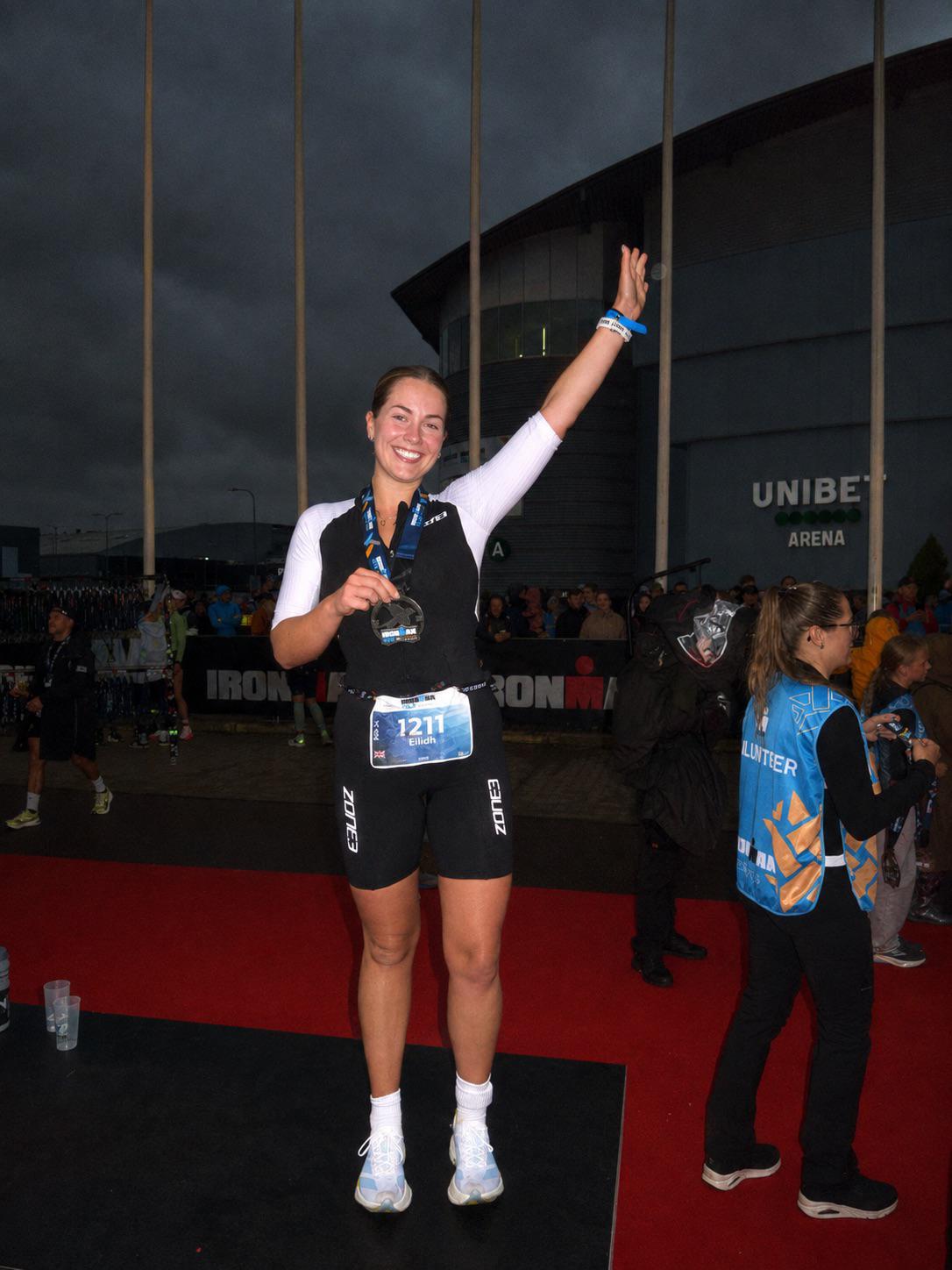 Eilidh celebrating at the IRONMAN Tallinn 70.3 finish line